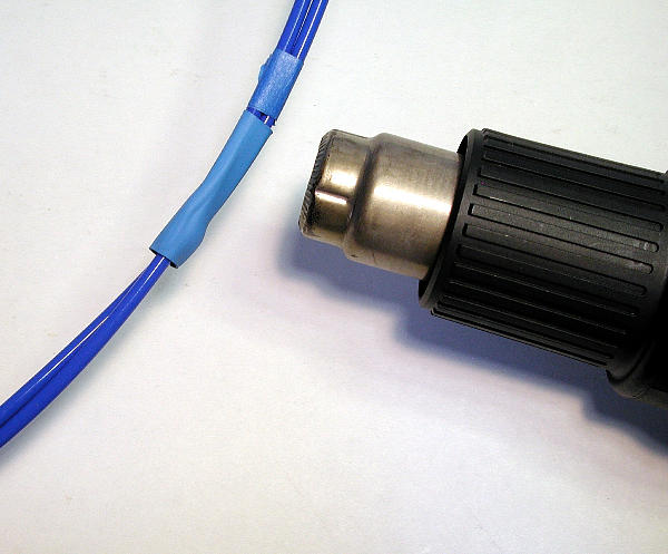 Applying heat to the heatshrink